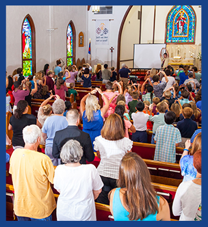 Church attendees participate in a sermon